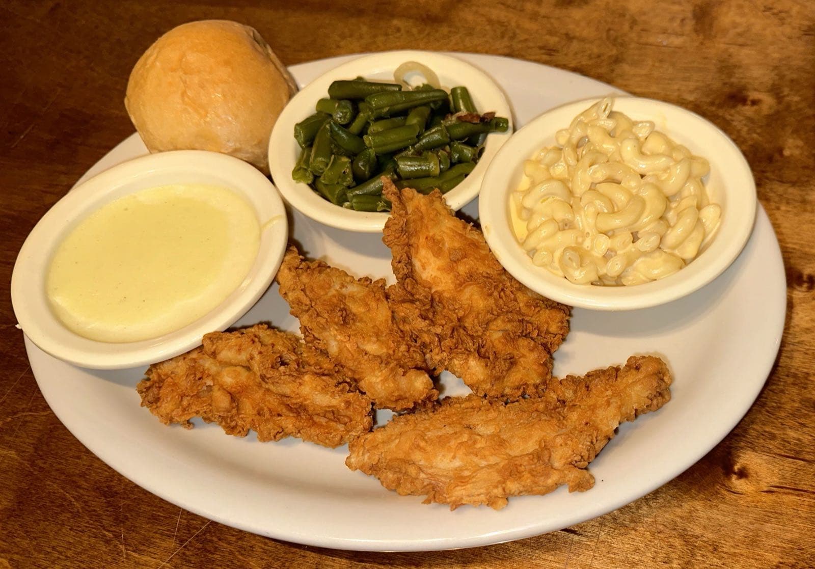 Fried chicken strip basket with cream gravy, mac and cheese, and green beans