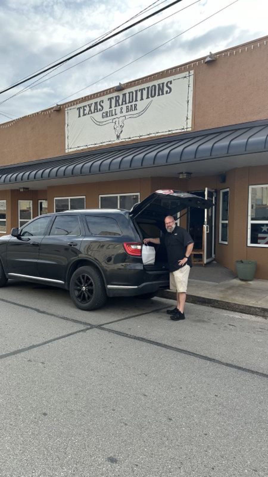 Texas Traditions branded to-go bags packed for delivery